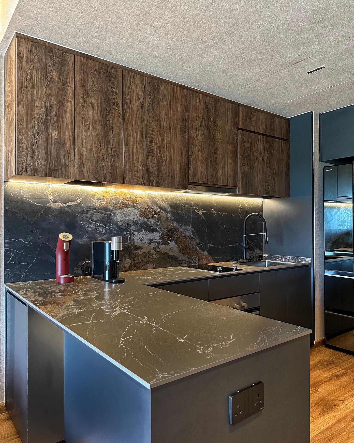 Dark walnut and navy condo kitchen counter